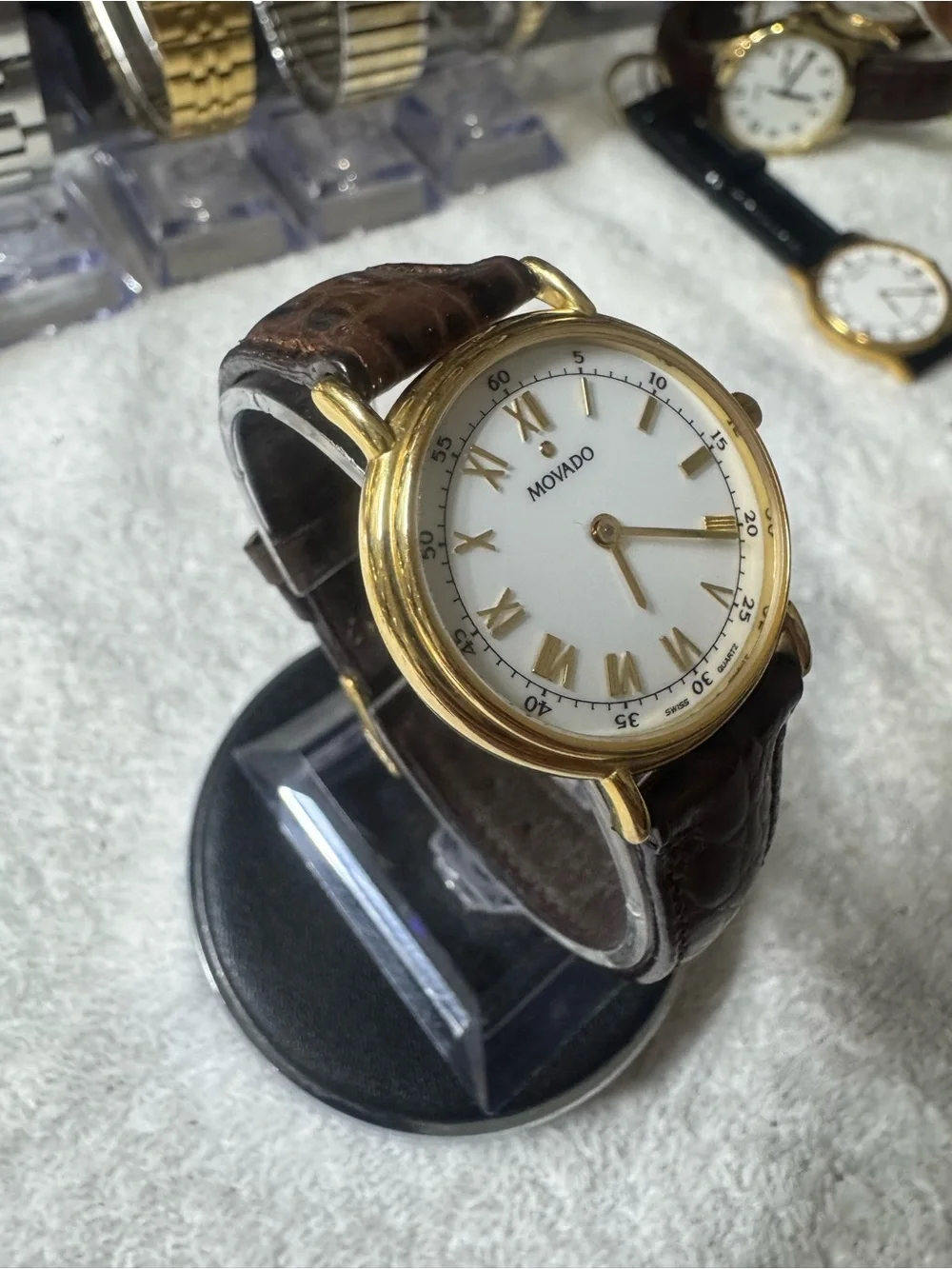 #120 Movado Gold Tone Case White Dial Watch with Brown Leather Strap